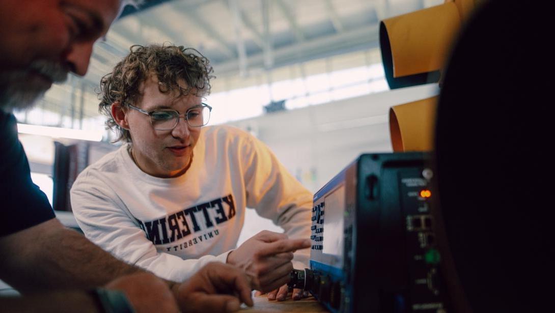 Computer Engineering students working with equipment