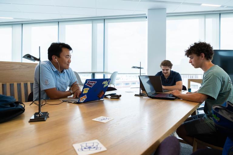 Students collaborate and focus on academic work in a bright, modern space at Kettering University's Learning Commons.