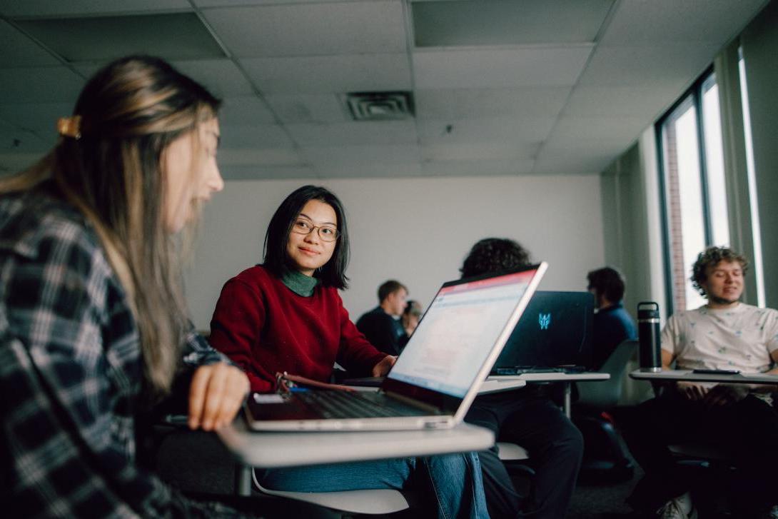 students engaging in conversation during class